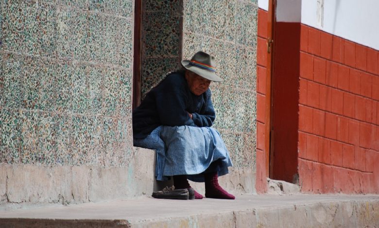 Older Woman of Cuzco Warming Herself in the Sun
