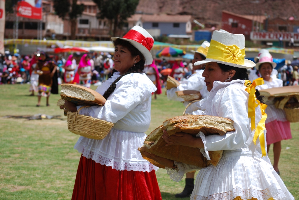 Cuzco Women Dancing with Chuta Bread