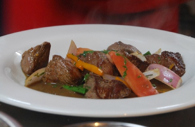 Perfectly Cooked Beef with Vegetables and Sauce of Lomo Saltado