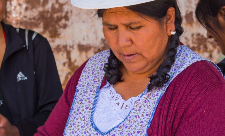 A Mamacha Serving a Cuzco Dish