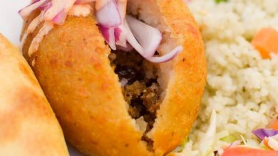 Our Delicious Combo: Stuffed Potato with an Empanada, Cilantro Rice and Sald! Yum!